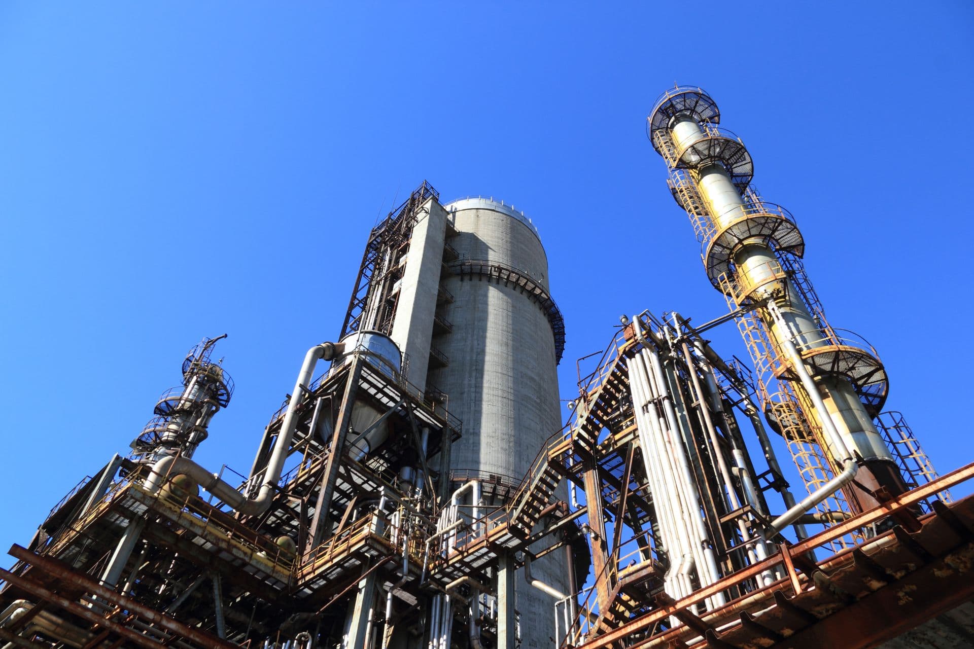 Industrial manufacturing plant structure against a blue sky