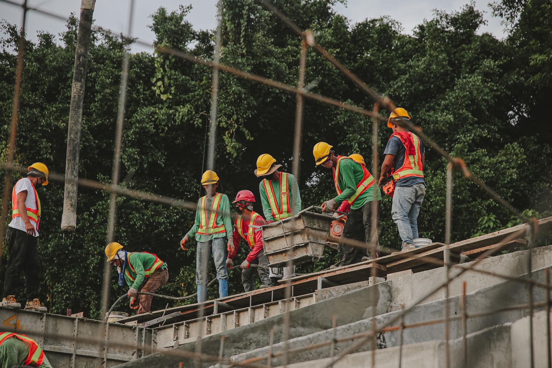 Construction crew in hard hats working on a building site
